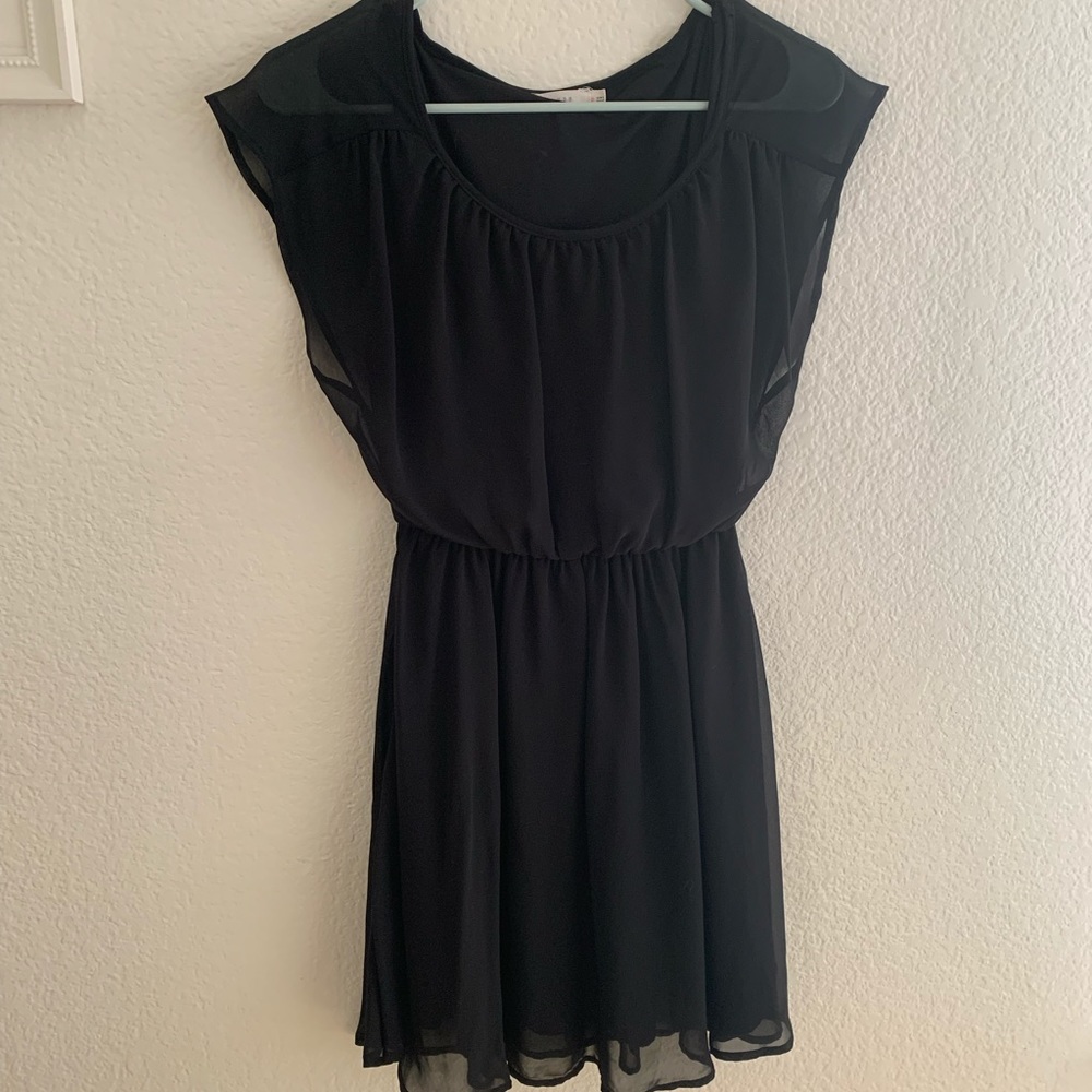 Flowy black dress with cinched waist